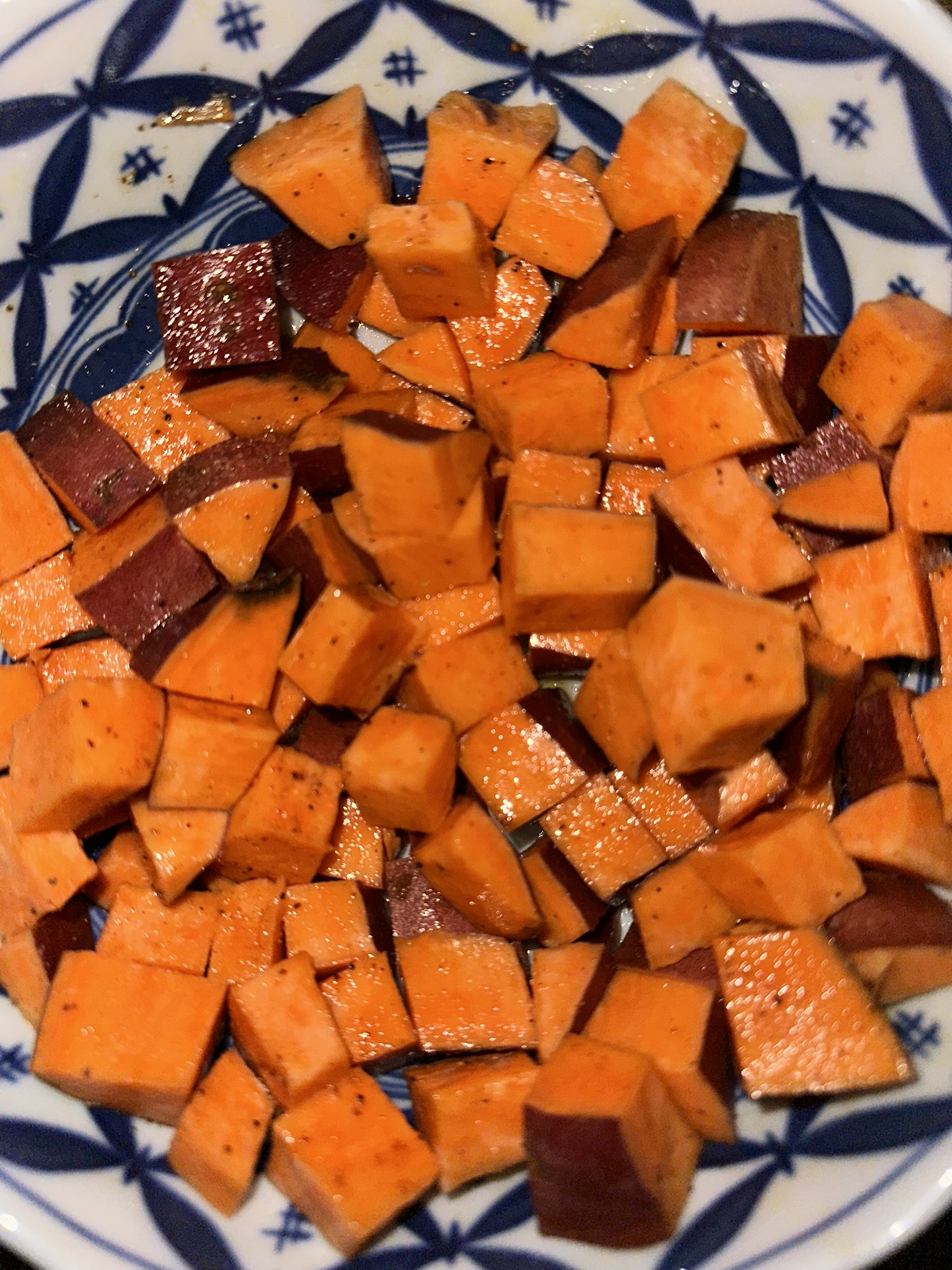 sweet potatoes diced, oiled, and seasoned