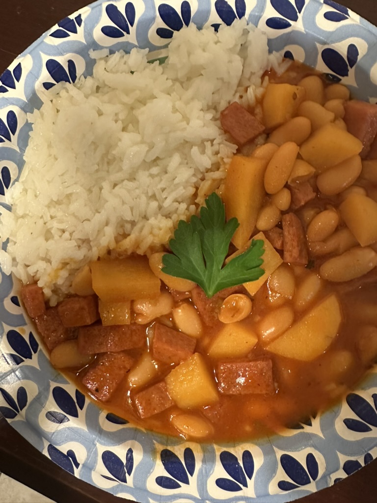 habichuelas guisadas served on a plate with white rice